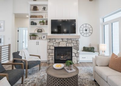 Simple white cabinets with a white oak mantle at 23 Applewood Court