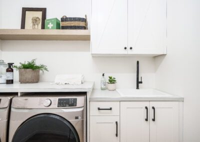 Simple white cabinets with white oak accents at 23 Applewood Court